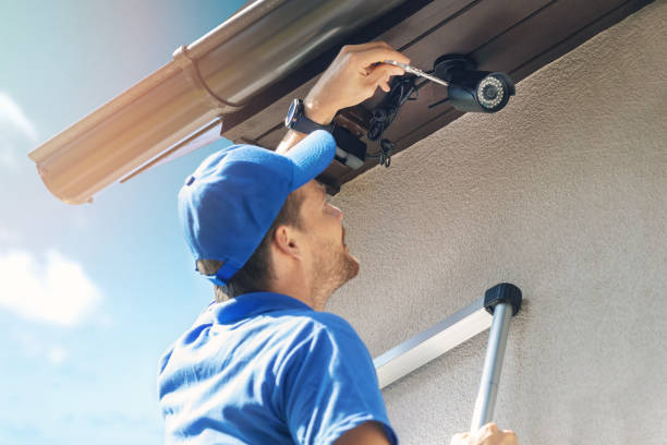 Commercial CCTV camera installer setting up security cameras for a business in Corona, CA
